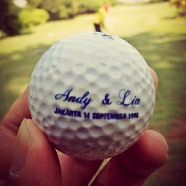 A sweet and personal found golf ball that was a wedding favor from a wedding all the way back in 1996.