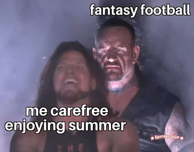 A menacing pro wrestler looms behind a laughing man; labels read “fantasy football” and “me carefree enjoying summer.”