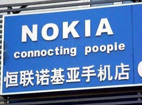 A classic image of a knock-off Nokia store sign where the famous slogan has been hilariously mistranslated as "connocting poopie."