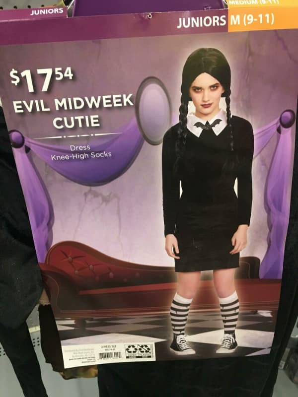 A generic Halloween costume of the character Wednesday Addams that has been brilliantly and hilariously renamed "Evil Midweek Cutie" to avoid copyright.
