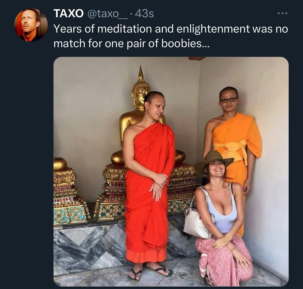 A funny and candid photo of two Buddhist monks who are breaking their concentration and vows of meditation to look at a woman who is kneeling in front of them.