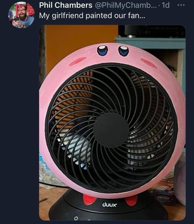 A photo from a tweet showing a small, round desk fan that a user's girlfriend has creatively painted pink to look exactly like the popular Nintendo video game character Kirby.