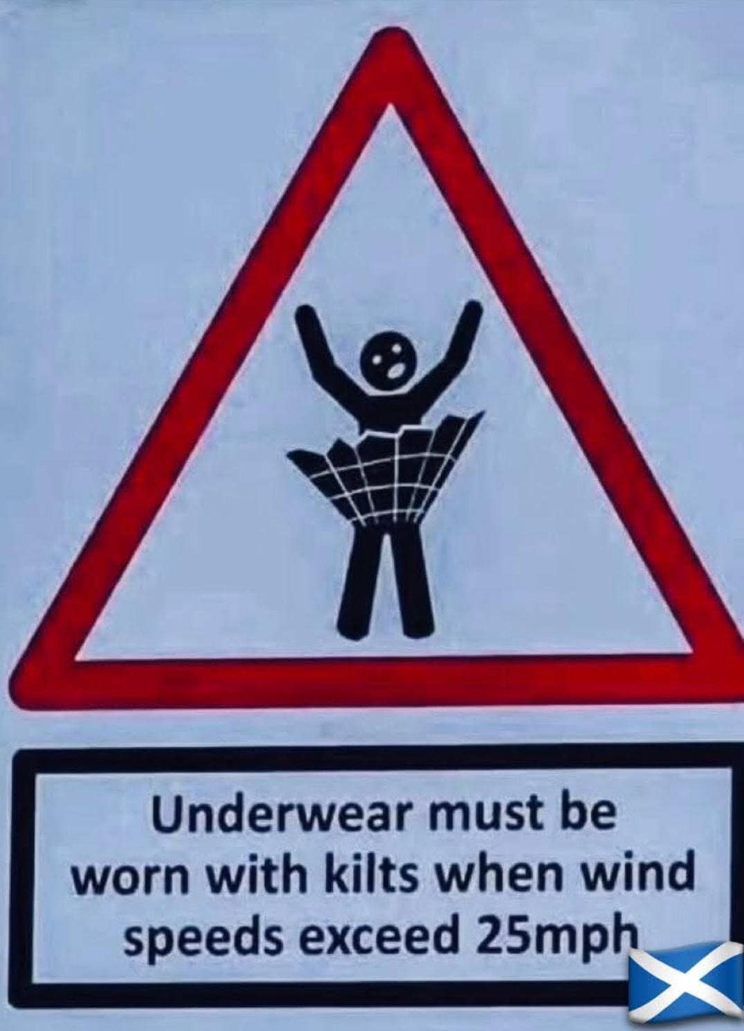 Triangle warning sign of a kilt flying up; text: “Underwear must be worn with kilts when wind speeds exceed 25 mph.”