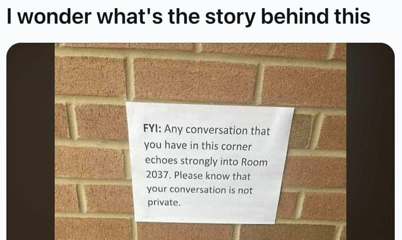 A funny sign in a hallway warning people that their private conversations in a specific corner can be heard in a room.