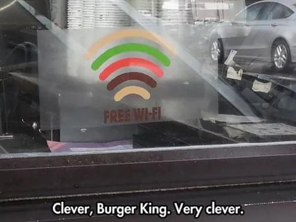 A clever and well-designed Burger King "Free Wi-Fi" sign where the signal arches are colored to resemble a hamburger.