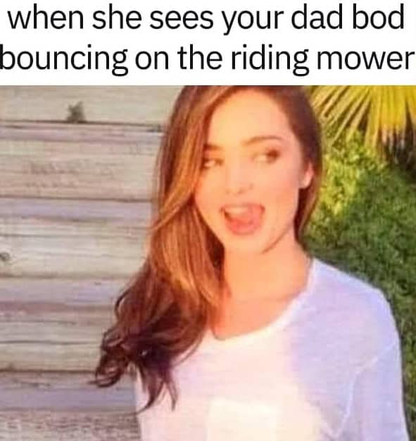 Humorous lawn care meme of a woman looking impressed by a dad bod on a riding mower.