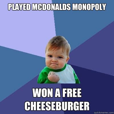 A vintage McDonalds Monopoly meme using the "Success Kid" format to celebrate winning a free cheeseburger.