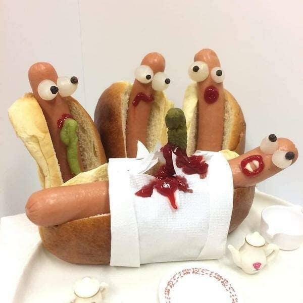 A meme dump photo of a hot dog funeral, with other hot dogs looking on in horror.