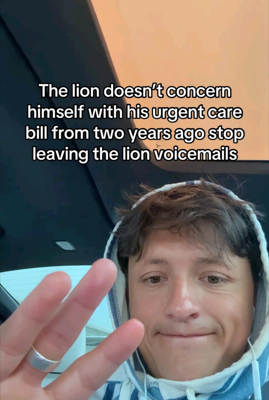 A funny meme screenshot from a video saying the lion doesn't concern himself with old urgent care bills.