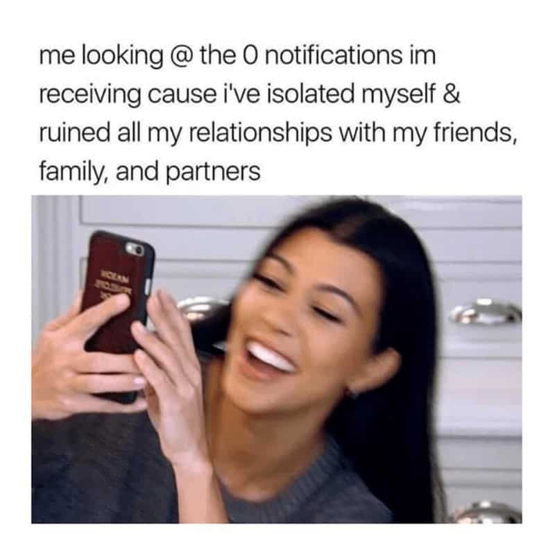 Woman laughing at her phone with caption about getting zero notifications after isolating and ruining relationships.