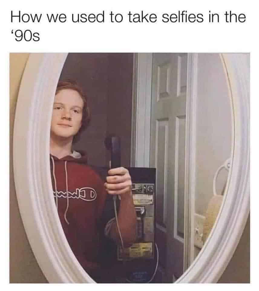 A 90s meme showing how people took selfies before front-facing cameras, with a boy using a landline phone in a mirror.