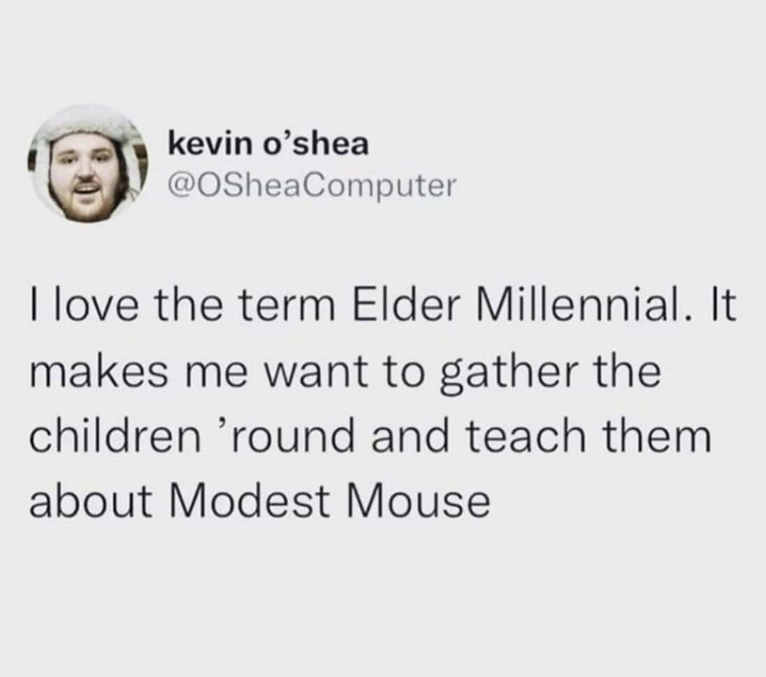 A funny millennial tweet about loving the term "Elder Millennial" and wanting to teach children about the band Modest Mouse.