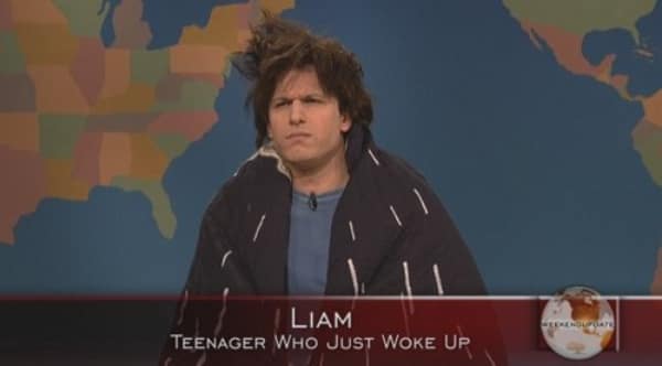 A screenshot of the actor Andy Samberg playing his classic character "Liam, Teenager Who Just Woke Up" from a very popular Saturday Night Live Weekend Update sketch.