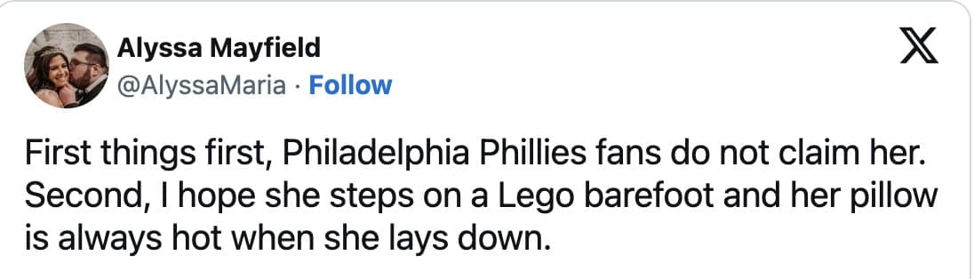 Tweet disowning the woman as a representative of Phillies fans and wishing petty inconveniences like stepping on a Lego and having a perpetually hot pillow.