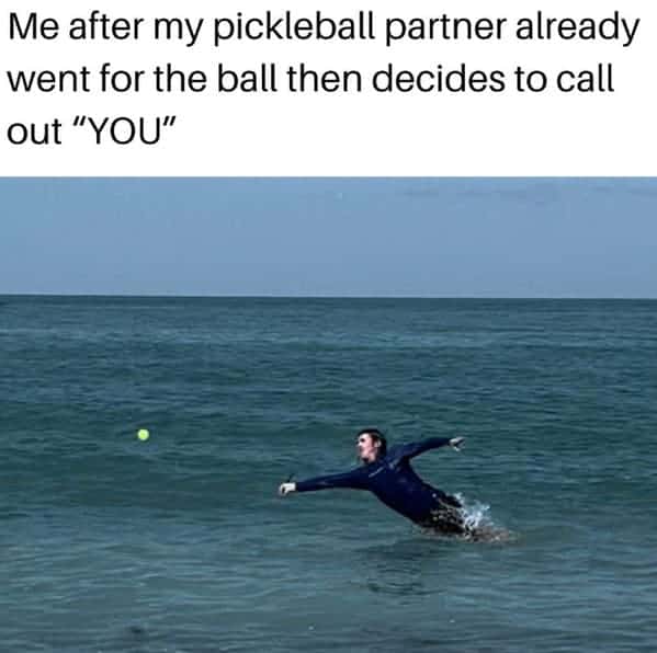 A funny meme of a man in a wetsuit who is desperately diving for a ball in the ocean, representing a pickleball player whose partner called the ball out late.