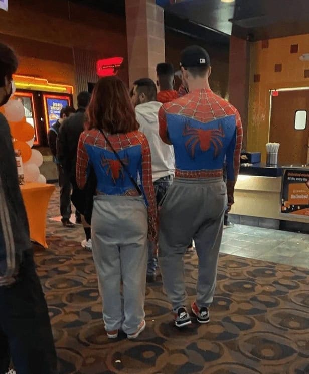 A perfect relationship goals meme of a cute couple wearing matching Spider-Man outfits to the movie theater.