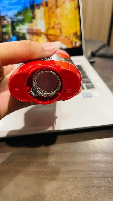 A satisfying picture of a finger ring fitting perfectly inside the bottom of a deodorant stick dispenser wheel.