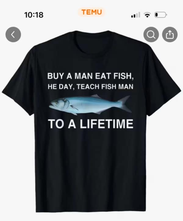 Black T-shirt mockup with mangled proverb: “BUY A MAN EAT FISH, HE DAY, TEACH FISH MAN TO A LIFETIME.”