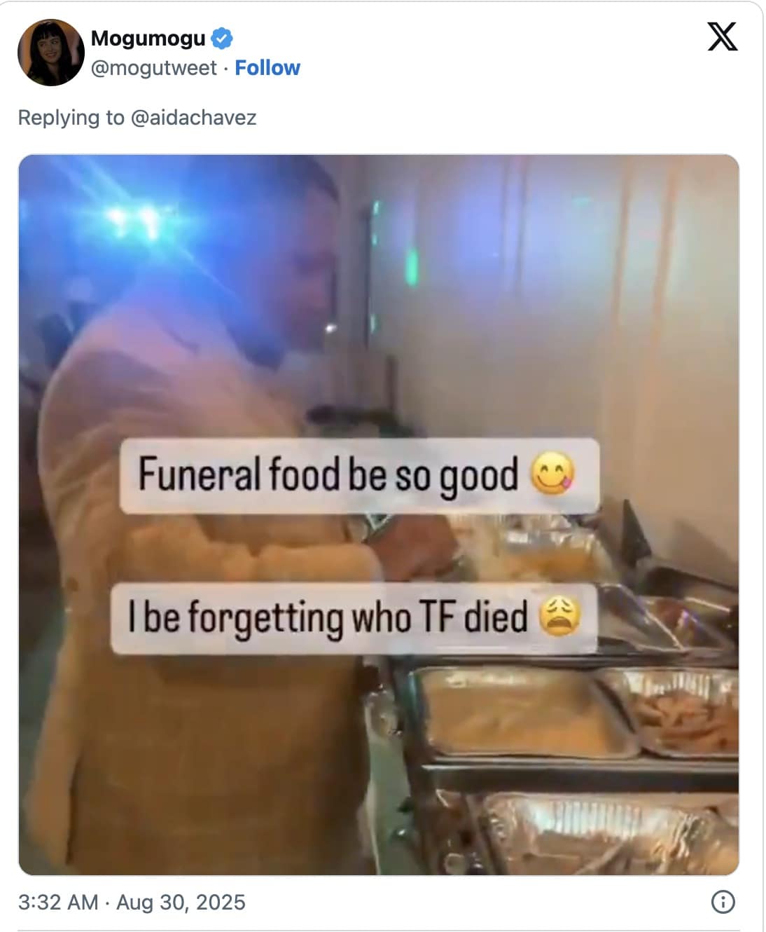 Tweeted video still of a man filling a plate at a buffet with overlaid text about funeral food being good.