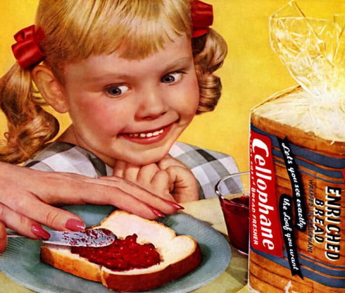 A creepy and unsettling vintage advertisement for cellophane-wrapped bread that features a little girl with a terrifyingly wide, manic, and unsettling smile.