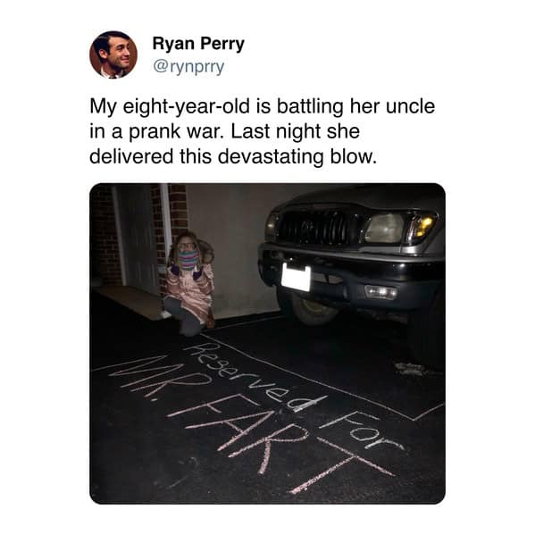 A dad's funny tweet showing his daughter's chalk art prank on her uncle, reserving a parking spot for "Mr. Fart."