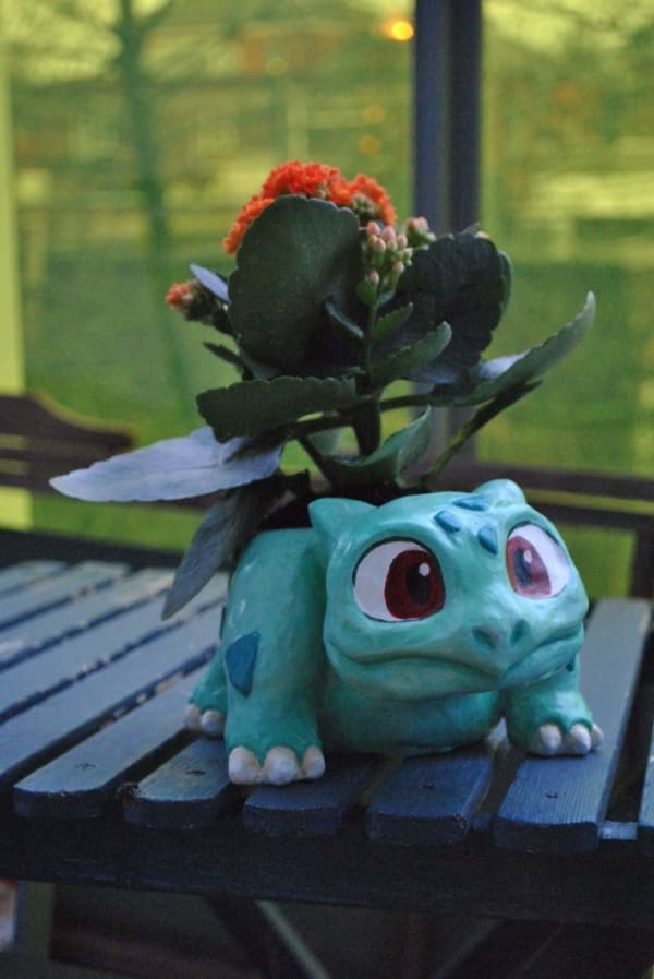 A handmade Pokémon planter shaped like a Bulbasaur, a nerdy and creative gardening DIY win.