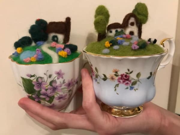 Two vintage teacups with miniature felted landscapes inside, an adorable and creative DIY win.