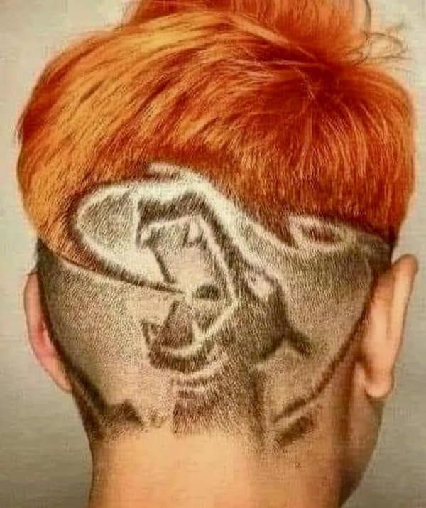 A wild example of bad haircuts with a grim reaper shaved into the back of someone's head.