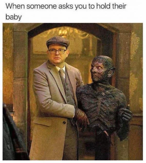 A classic meme from 'What We Do in the Shadows' about holding a baby.