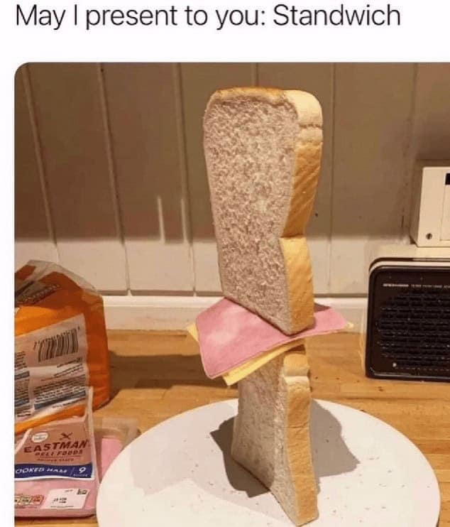 A funny cooking meme showing a ham and cheese sandwich balanced precariously vertically, dubbed a "Standwich."
