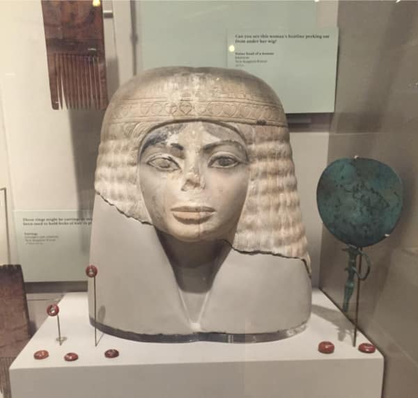 A classic cursed image of an ancient Egyptian statue in a museum that looks exactly like Michael Jackson.
