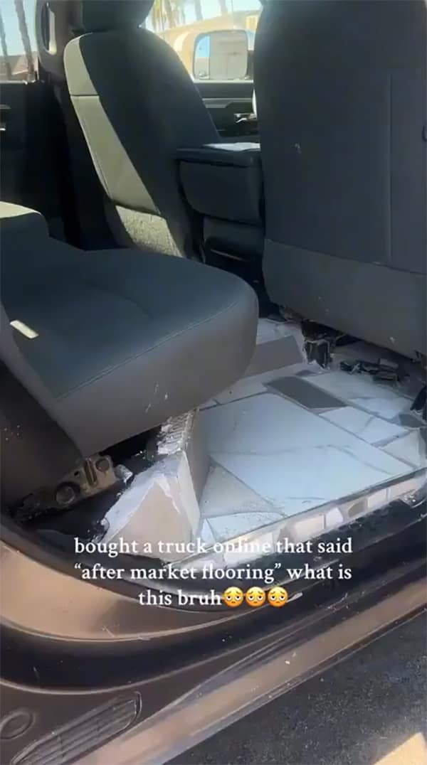 A DIY fail showing the back of a truck with ceramic kitchen tiles installed as "after market flooring."