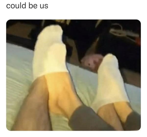 A funny flirty meme with a blurry picture of feet in socks captioned "could be us."