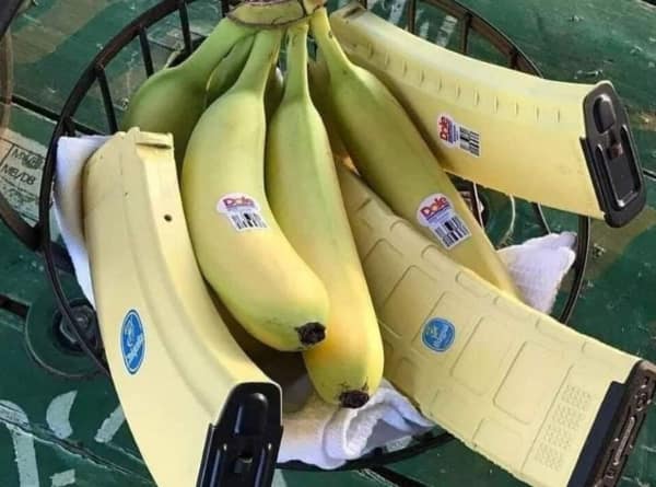 A cursed food image showing a bowl of bananas mixed in with yellow "banana clips" (ammunition magazines).