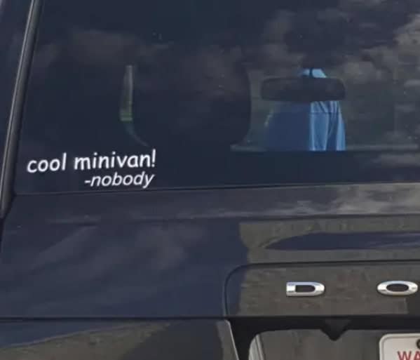 A funny bumper sticker on a minivan that says, "'cool minivan!' -nobody."