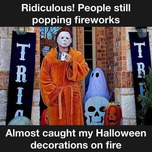 A funny meme of Michael Myers in a bathrobe, annoyed that fireworks are endangering his Halloween display.