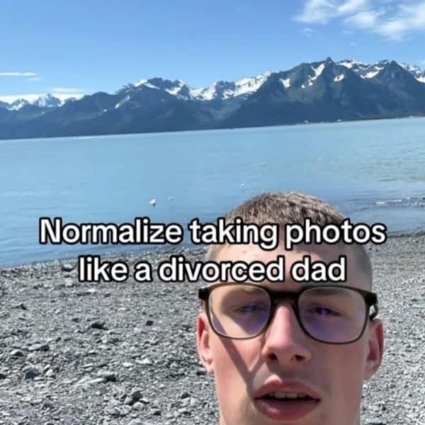 A meme encouraging people to "Normalize taking photos like a divorced dad," featuring a low-angle selfie.