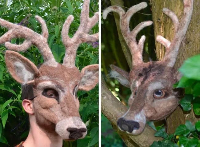 A person wearing an incredibly realistic and slightly unsettling handmade felt deer mask with large antlers.