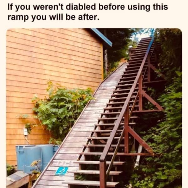 A funny picture of a dangerously steep and unsafe wooden ramp for disabled people.