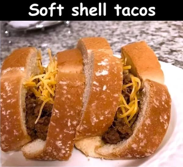 A cursed food image of "soft shell tacos" made with ground beef in hot dog buns.