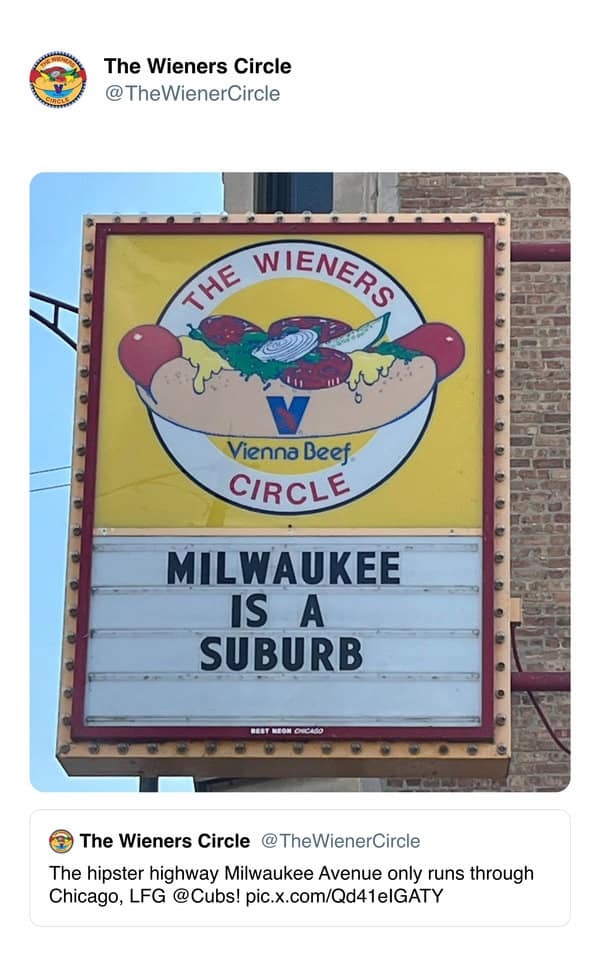 A funny sports meme from The Wiener's Circle in Chicago, with a sign that says "Milwaukee is a suburb."