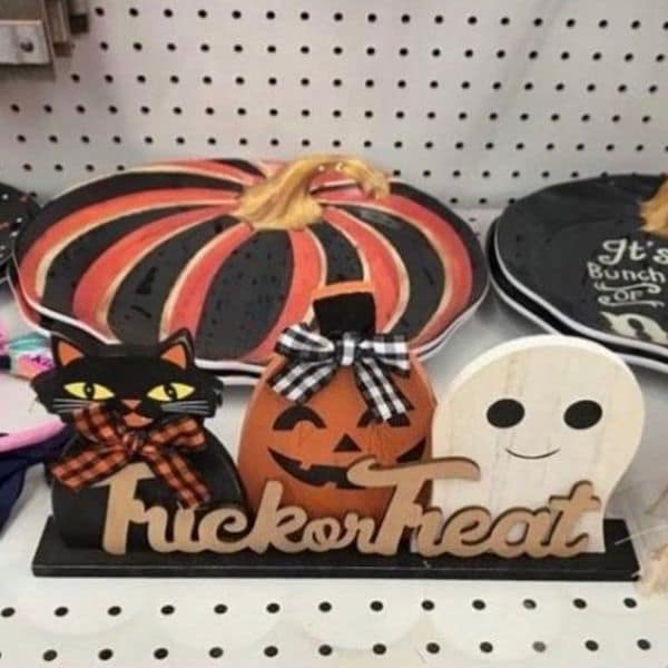 A grumpy meme showing a Halloween decoration with a funny, inappropriate typo on it.