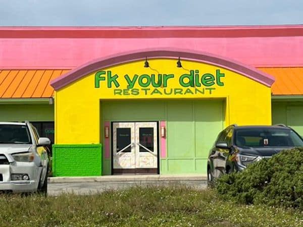 A grumpy meme of a restaurant with the aggressive and funny name "Fk Your Diet."