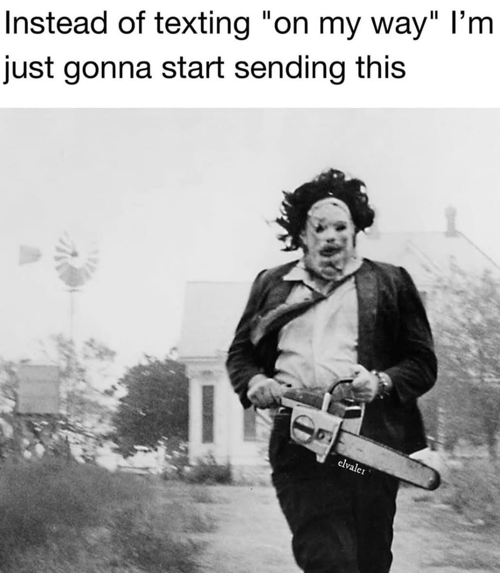 A funny horror movie meme suggesting sending a picture of Leatherface running as an "on my way" text this Halloween.