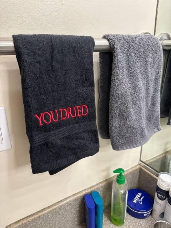 A funny black towel with "YOU DRIED" embroidered in red, referencing the Dark Souls "You Died" screen.