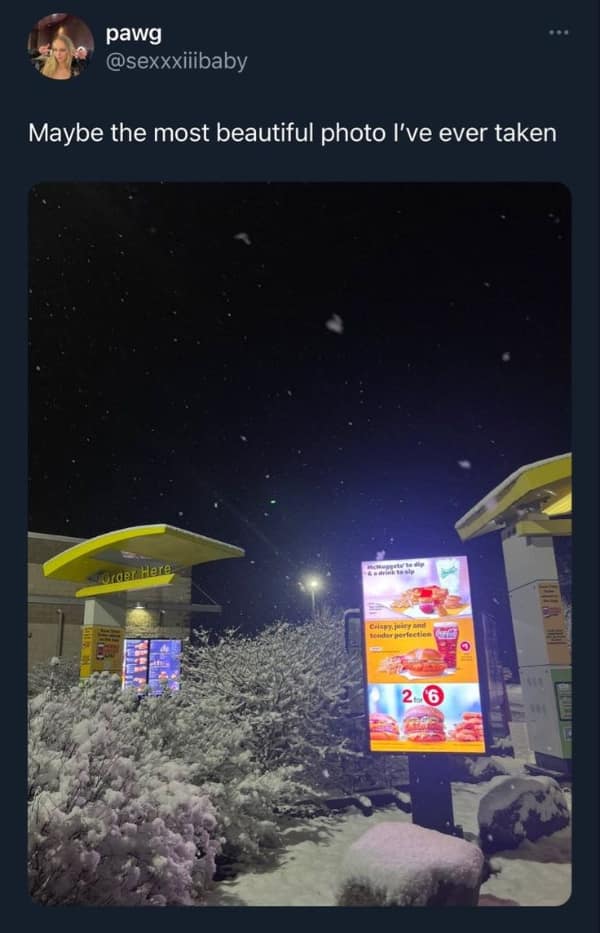 A beautiful, snowy photo of a McDonald's drive-thru at night, posted as a lifemaxxing vibe.
