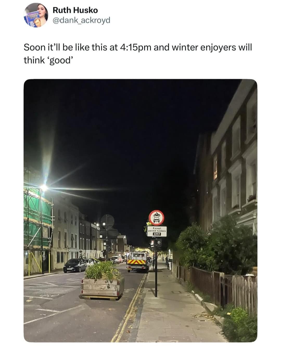 A funny meme tweet about it getting dark at 4:15 pm, and how "winter enjoyers" will think it's a good thing.