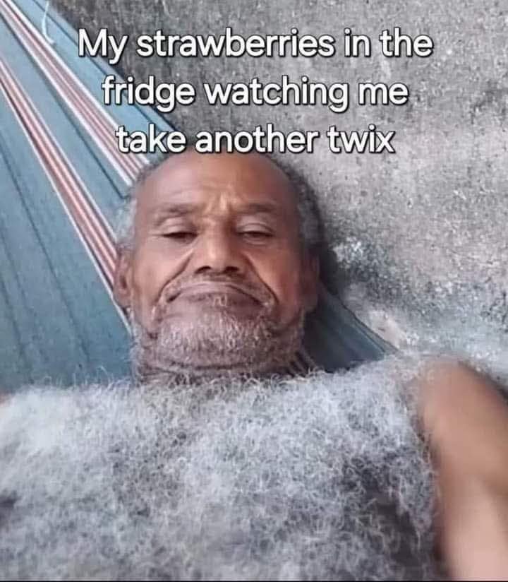 A funny meme using a picture of a sad, hairy man to represent how strawberries in the fridge feel when you eat a Twix instead.