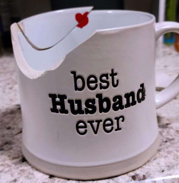 A funny no context image of a "Best Husband Ever" mug that is ironically broken.