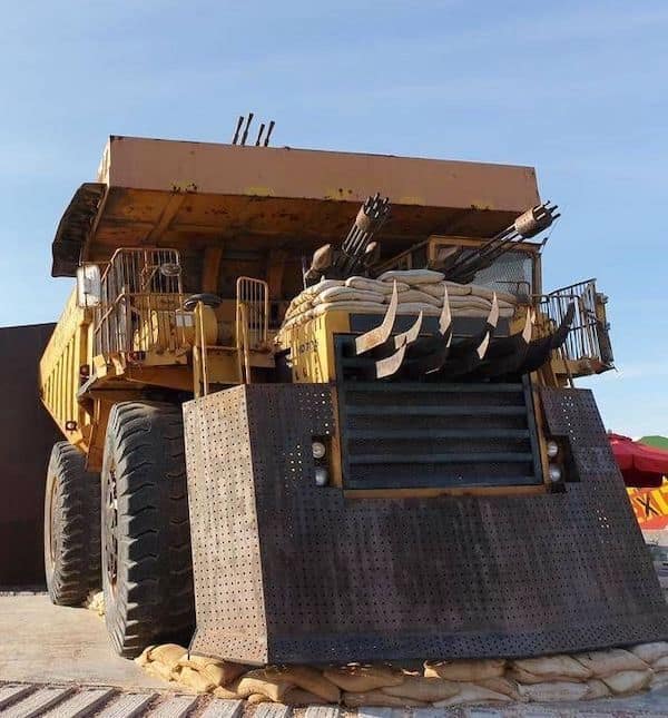 A no context image of a huge mining truck modified to look like a 'Mad Max' vehicle.